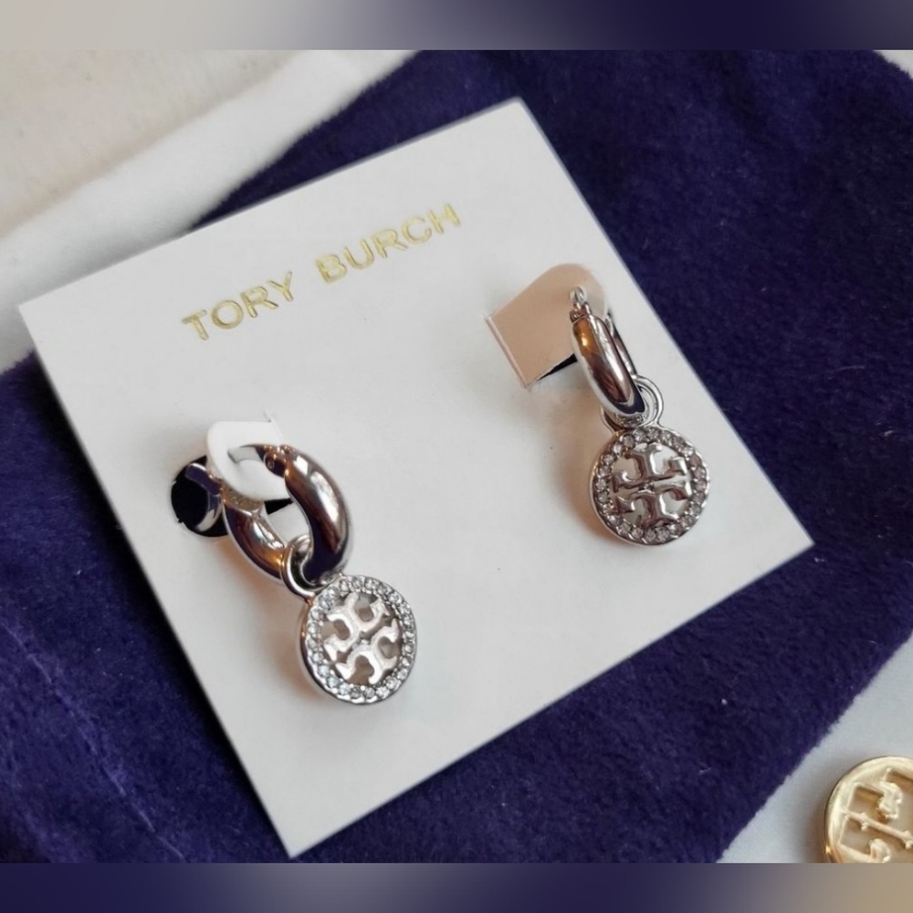Silver earrings by Tory Burch